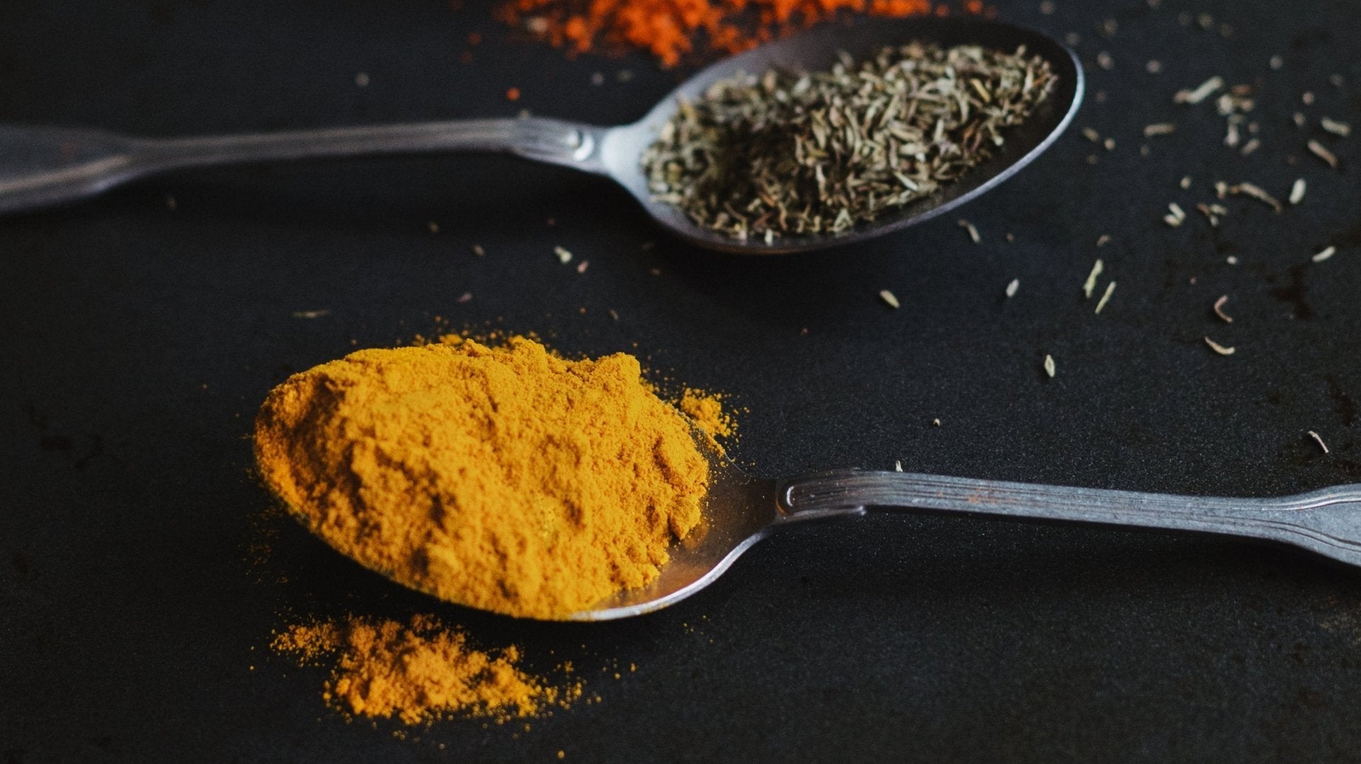 Colorful Asian spices on spoons
